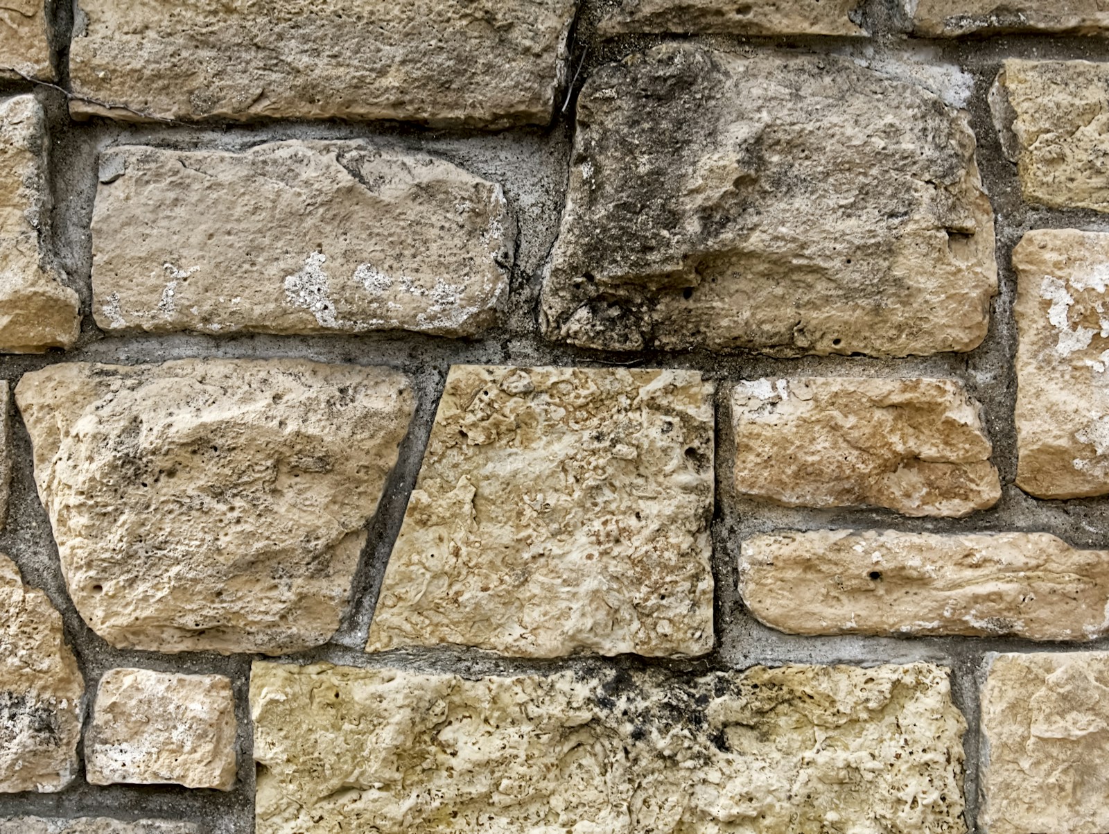 A close-up of a stone wall made of rocks.